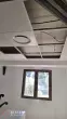Diffuseur circulaire de climatisation intégré au faux plafond pendant les travaux